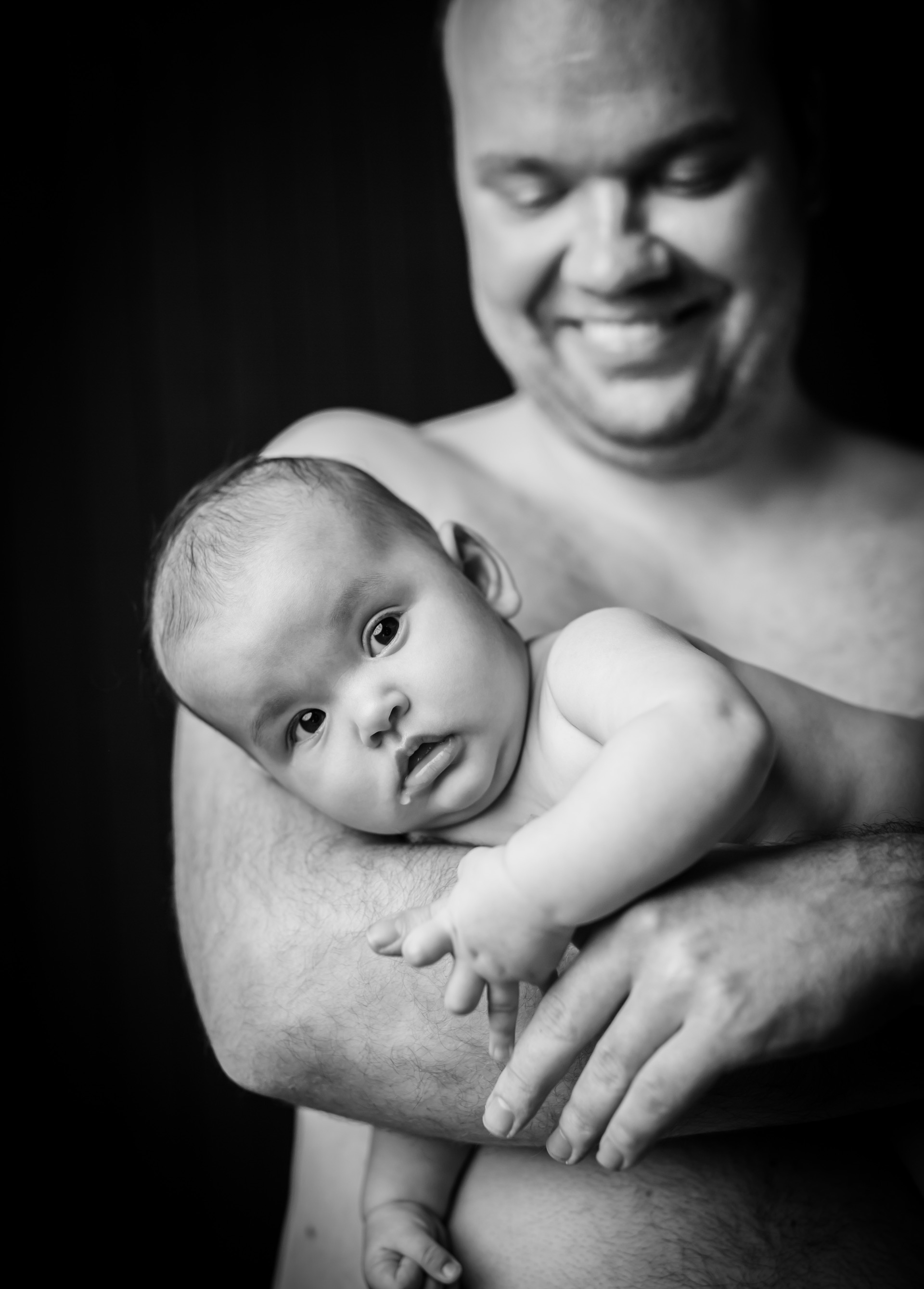 Newborn having skin to skin time with daddy.